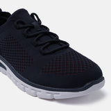 Dark blue comfort sneakers by bugatti with knit texture, matching laces, and a white sole.
