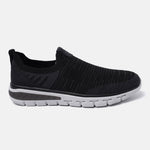 Black comfort sneakers by bugatti with a slip-on style, knit upper, and white sole.
