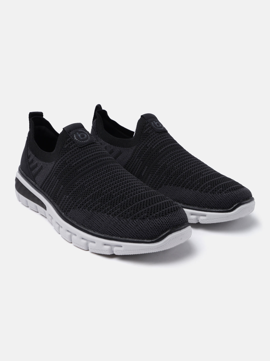 Black comfort sneakers by bugatti featuring a breathable knit texture and contrasting white sole.