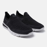 Black comfort sneakers by bugatti featuring a breathable knit texture and contrasting white sole.