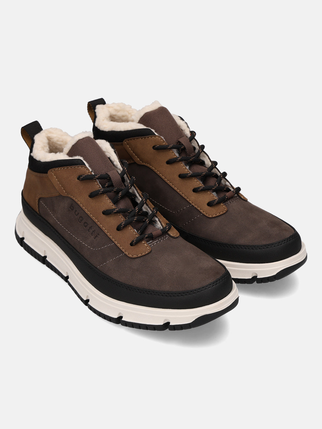 Brown casual boots by Bugatti, with black laces, white platform sole and faux fur lining.