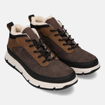 Brown casual boots by Bugatti, with black laces, white platform sole and faux fur lining.