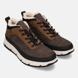 Brown casual boots by Bugatti, with black laces, white platform sole and faux fur lining.