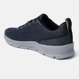 Blue comfort sneaker by bugatti with a textured design and grey midsole, shown in a back angle view.