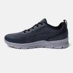 Blue comfort sneaker by Bugatti, shown in a side view with dark laces and a contrasting gray sole.