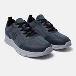 Blue comfort sneakers by bugatti, featuring a subtle striped pattern and black laces.