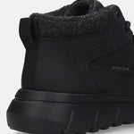 Black comfort casual boots by Bugatti with a herringbone-patterned wool collar and a textured sole.
