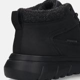 Black comfort casual boots by Bugatti with a herringbone-patterned wool collar and a textured sole.