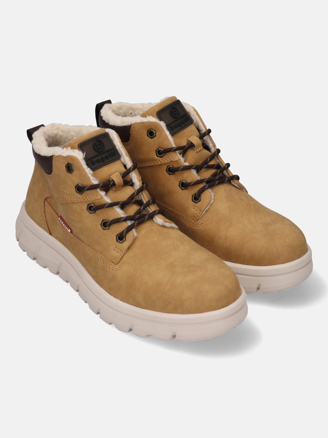 Tan comfort casual boots by Bugatti with brown laces, visible white faux fur lining and off-white soles.
