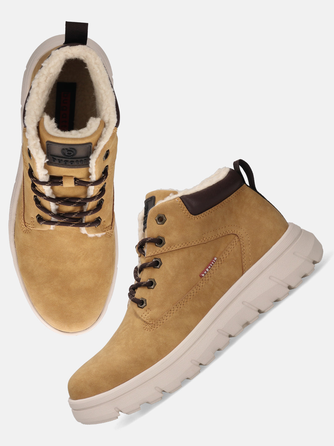 Yellow comfort casual boots by Bugatti with brown laces and a white ridged sole.