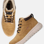 Yellow comfort casual boots by Bugatti with brown laces and a white ridged sole.