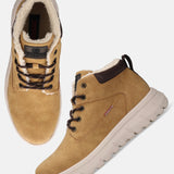 Yellow comfort casual boots by Bugatti with brown laces and a white ridged sole.