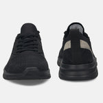 Black comfort mid-top sneakers by bugatti, with textured knit uppers and tonal soles.