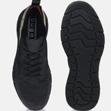 Black comfort mid-top sneakers by bugatti, with a knit texture and black soles.