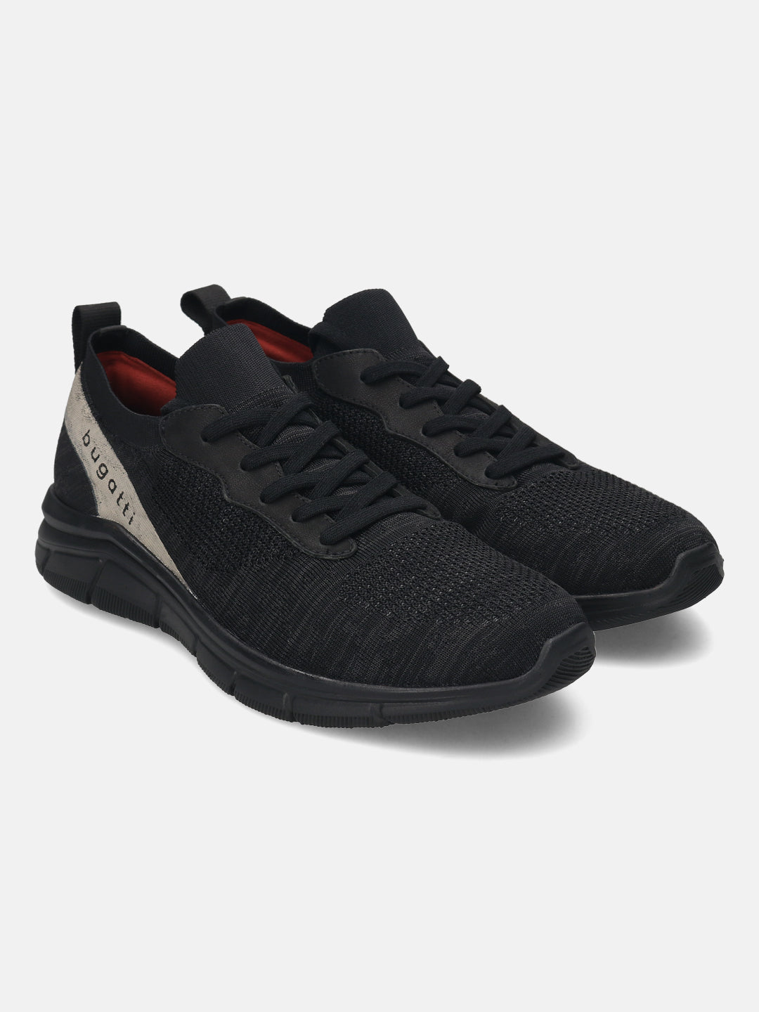 Black comfort sneakers by bugatti featuring a knit textile upper and tonal sole.
