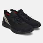Black comfort sneakers by bugatti featuring a knit textile upper and tonal sole.