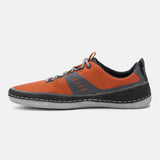 Orange comfort low-top sneaker by bugatti with gray accents, contrast stitching, and textured material.