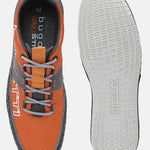 Orange sneakers by Bugatti with gray accents, laces, and sawtooth patterned sole.