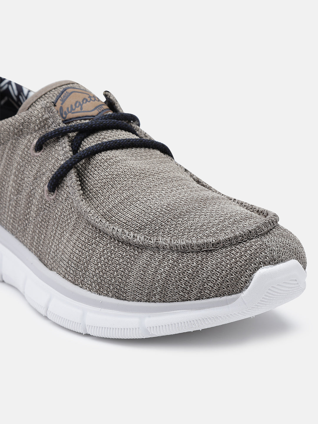 A beige Men's bugatti Sneakers featuring a round plain toe, zero heels heel. Made from textile with a durable eva outsole, this laces design offers both style and comfort.