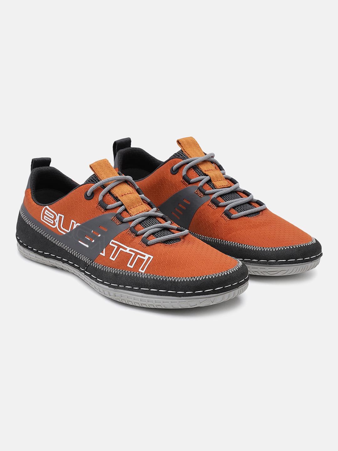 Orange comfort low top sneakers by bugatti with gray laces and white stitching.