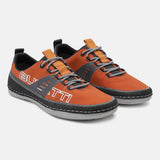 Orange comfort low top sneakers by bugatti with gray laces and white stitching.