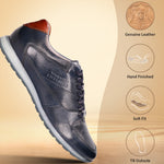 Dark blue leather sneaker by bugatti with a brown heel accent and light grey sole.