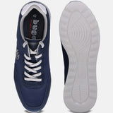 Dark blue comfort sneakers by bugatti, showing the white laces and white ridged soles.