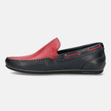 Dark blue leather slip-on shoe by bugatti, featuring red perforated detailing and accent laces.