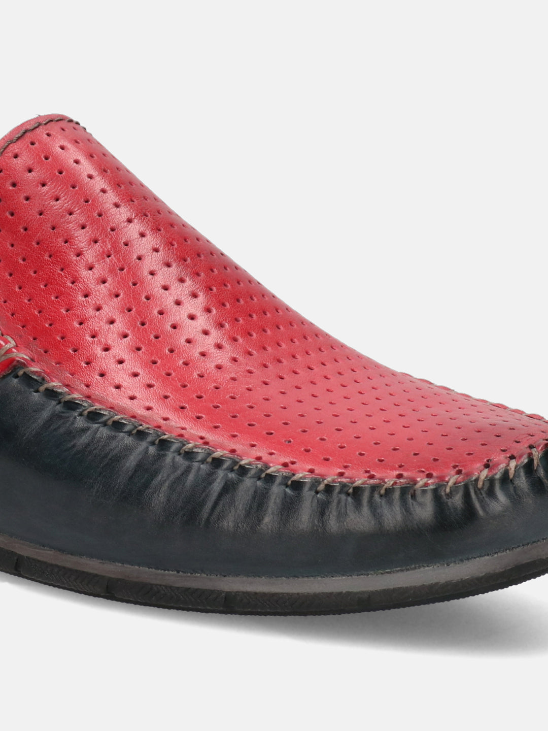 Red and dark blue leather slip-on shoe by bugatti with decorative stitching detail.