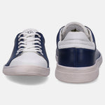 White and navy sneakers by bugatti with white laces and soles, viewed from the front and back.