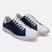 Leather sneakers by bugatti with white and blue color-blocking and white laces.