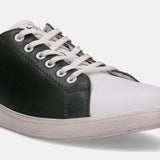 White and green leather sneaker by bugatti, with visible stitching and a textured sole.